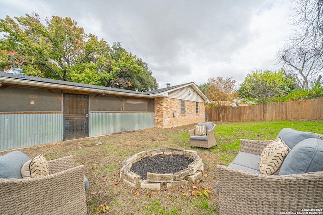 view of yard with an outdoor fire pit