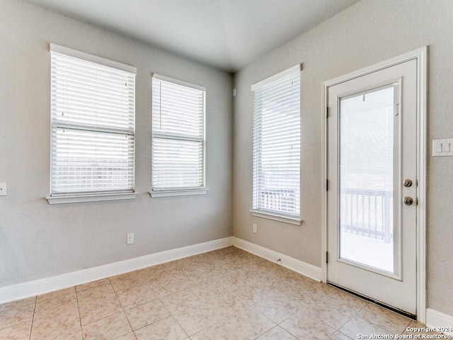 entryway with light tile patterned floors