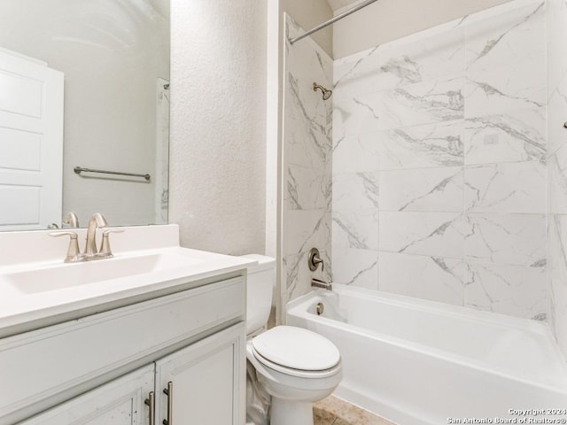 full bathroom with vanity, toilet, and tiled shower / bath