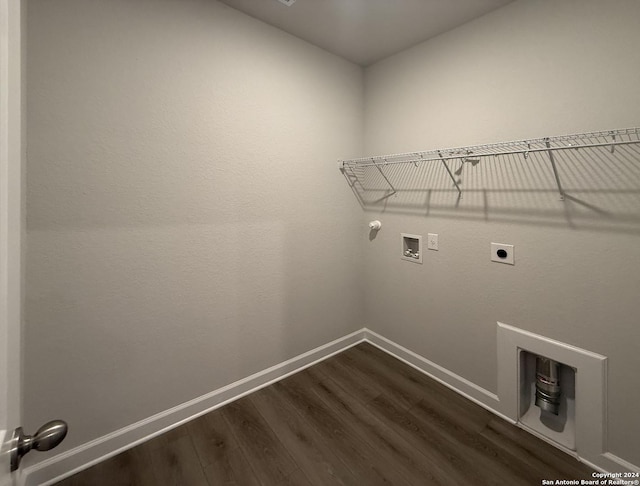 laundry room with electric dryer hookup, gas dryer hookup, dark hardwood / wood-style flooring, and washer hookup