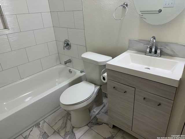 full bathroom with tiled shower / bath, vanity, and toilet