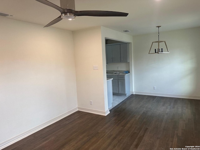 interior space featuring ceiling fan and dark wood-type flooring