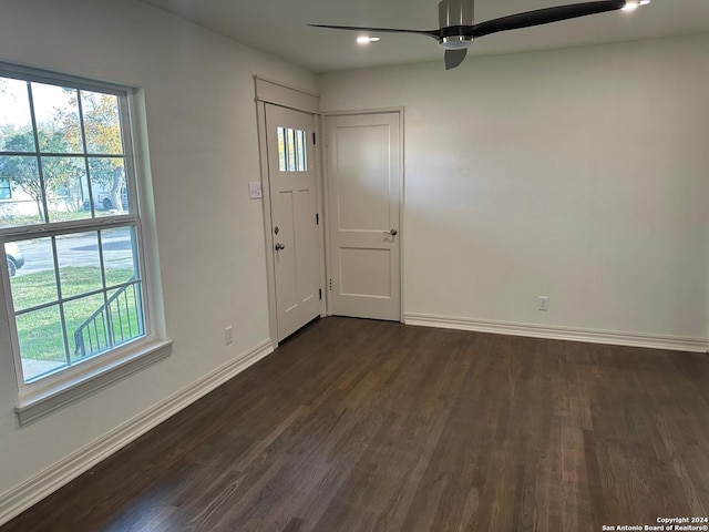 foyer entrance featuring dark hardwood / wood-style flooring and ceiling fan