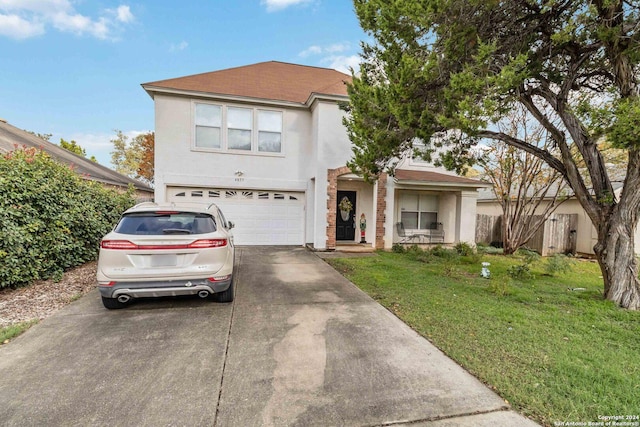 view of front facade featuring a front yard and a garage