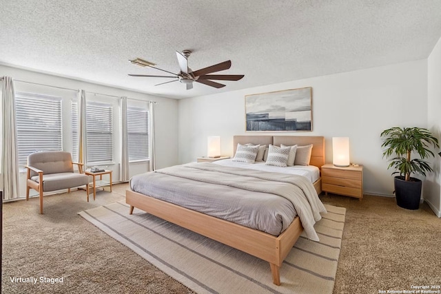 4859 Corian Spgs, San Antonio, TX 78247 - bedroom featuring carpet flooring, a textured ceiling, and a ceiling fan