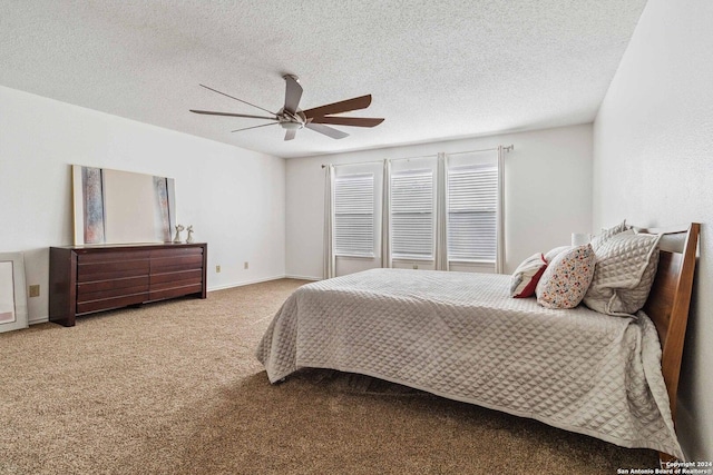 bedroom with carpet flooring, a textured ceiling, and ceiling fan