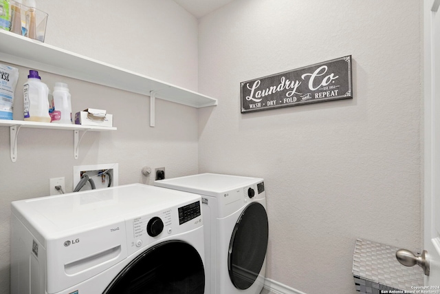 clothes washing area featuring washing machine and dryer