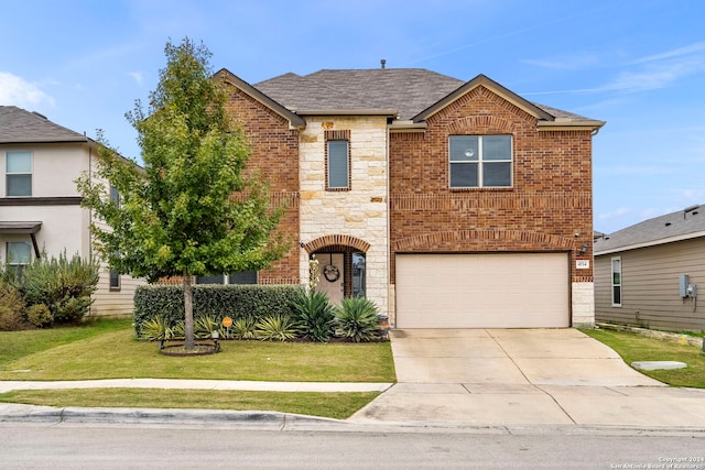 view of property featuring a front yard and a garage