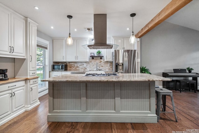 kitchen with white cabinets, a kitchen island, decorative light fixtures, island range hood, and stainless steel appliances