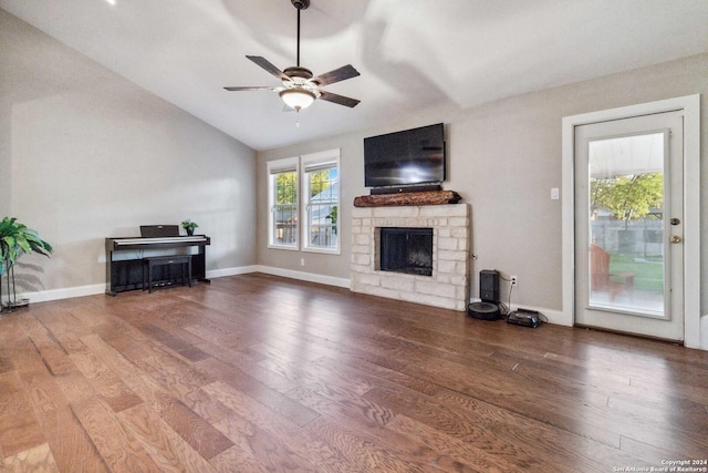 unfurnished living room featuring a fireplace, wood-type flooring, and vaulted ceiling