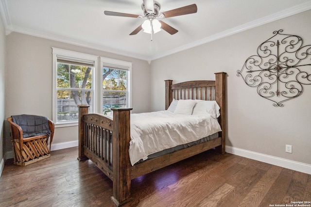 bedroom featuring dark hardwood / wood-style floors, ceiling fan, and crown molding