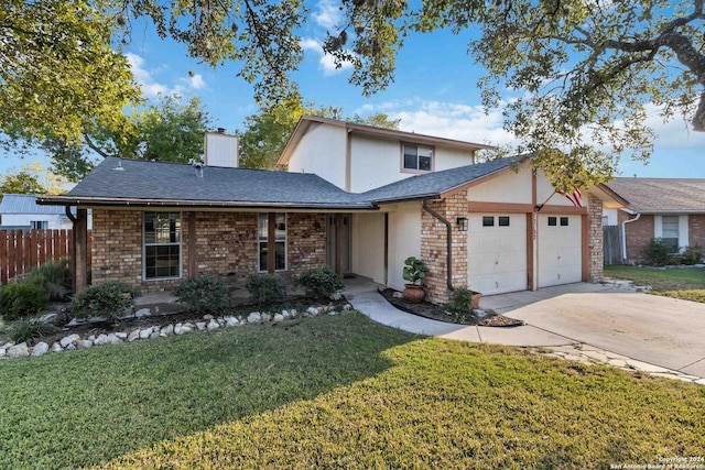 front of property with a front yard and a garage