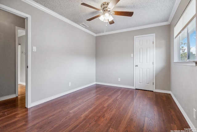 unfurnished room with a textured ceiling, dark hardwood / wood-style floors, ceiling fan, and ornamental molding