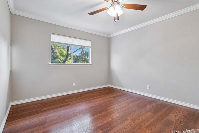 spare room featuring dark hardwood / wood-style floors, ceiling fan, and crown molding