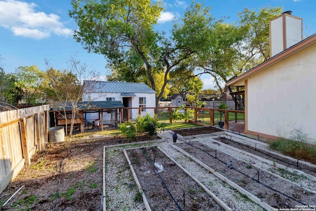 wooden terrace featuring an outbuilding