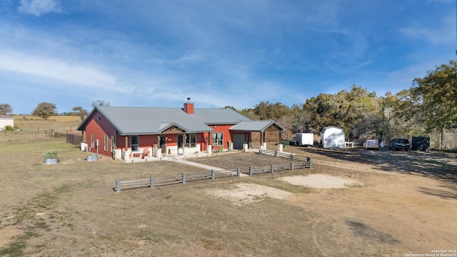 view of front of home with an outdoor structure