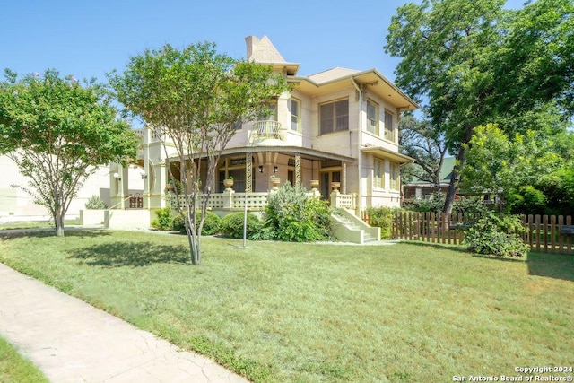 view of front facade with a porch and a front yard