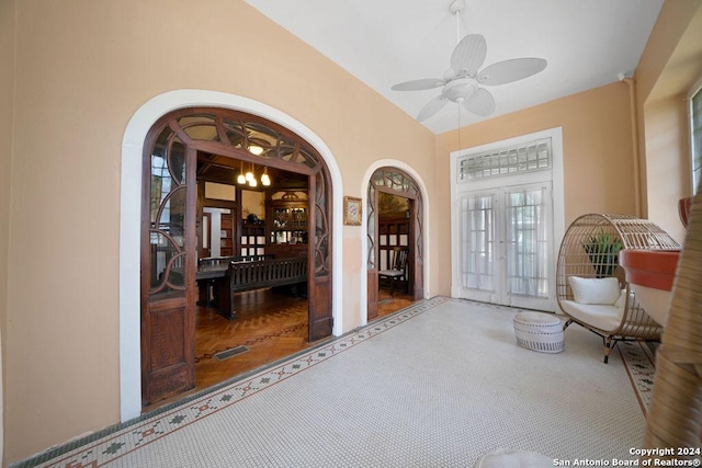 entrance to property featuring french doors and ceiling fan