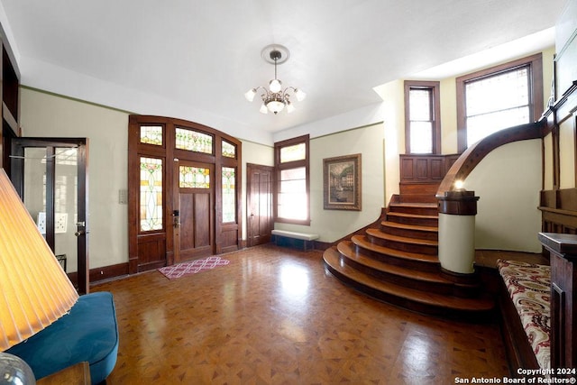 foyer featuring a chandelier