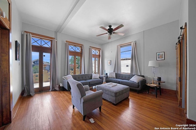 living room featuring ceiling fan, wood-type flooring, and french doors