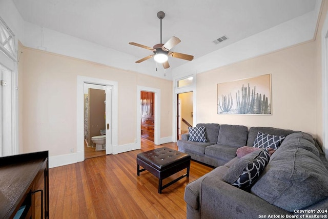 living room featuring ceiling fan and wood-type flooring