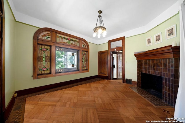 interior space with parquet floors and a notable chandelier