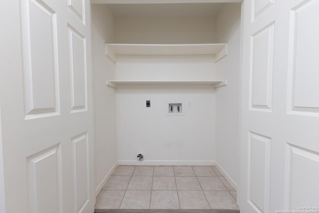 washroom featuring hookup for a washing machine, light tile patterned flooring, and hookup for an electric dryer