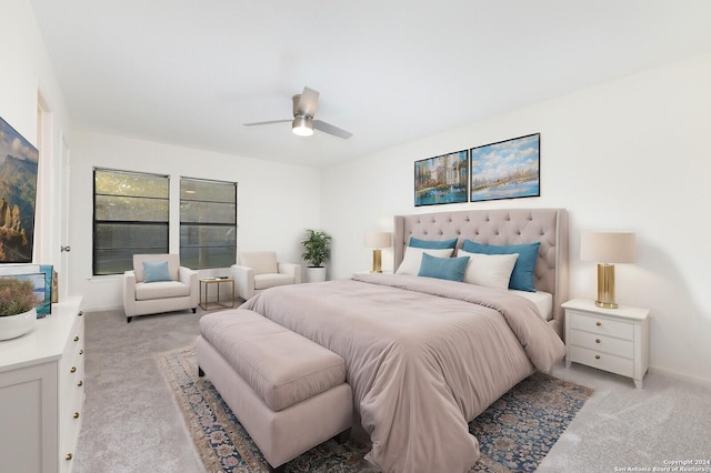 bedroom with ceiling fan and light carpet