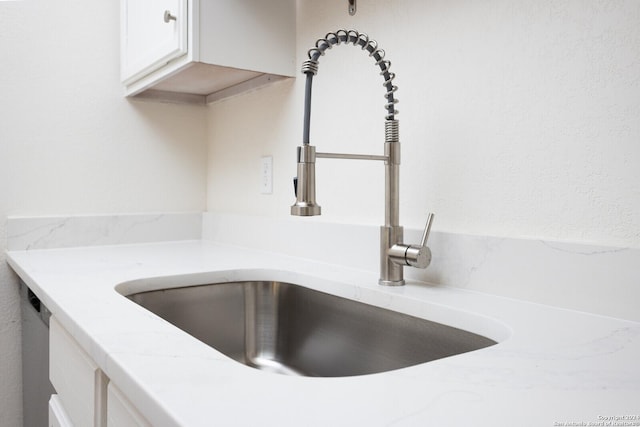 room details with sink and white cabinets