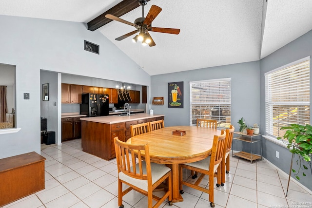 tiled dining space featuring high vaulted ceiling, sink, ceiling fan, a textured ceiling, and beamed ceiling