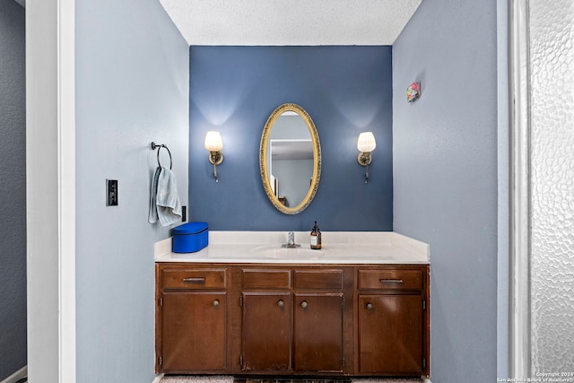 bathroom featuring vanity and a textured ceiling