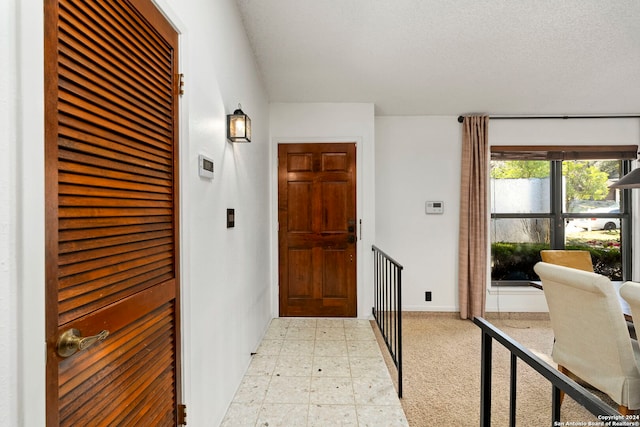 interior space with a textured ceiling