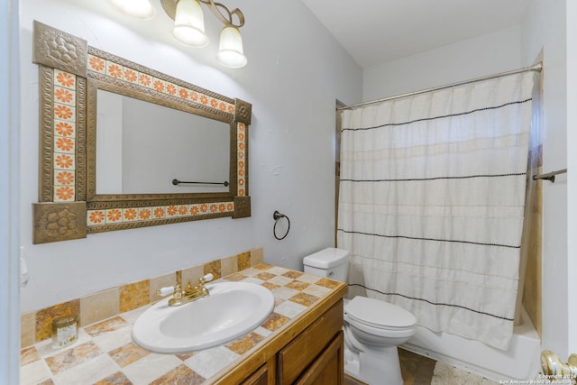 full bathroom featuring shower / bath combination with curtain, vanity, and toilet