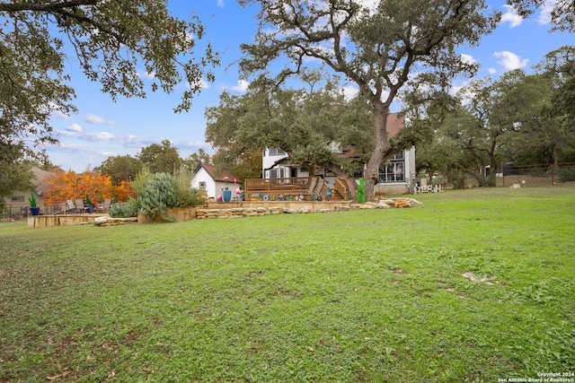 view of yard featuring a wooden deck