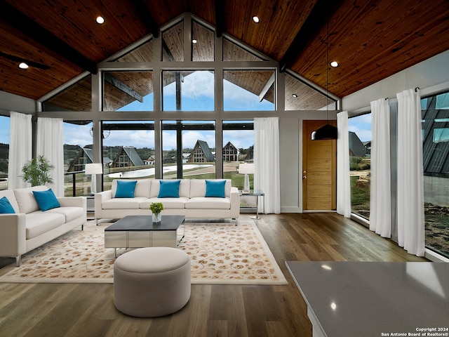 sunroom featuring wooden ceiling, plenty of natural light, and lofted ceiling