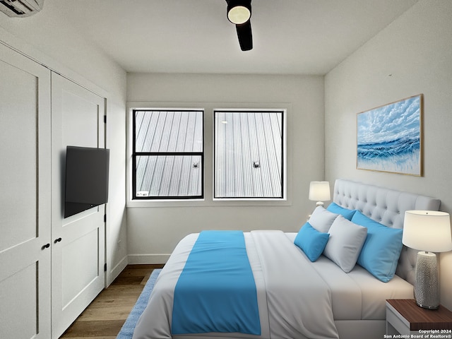 bedroom with ceiling fan, a closet, and dark hardwood / wood-style floors