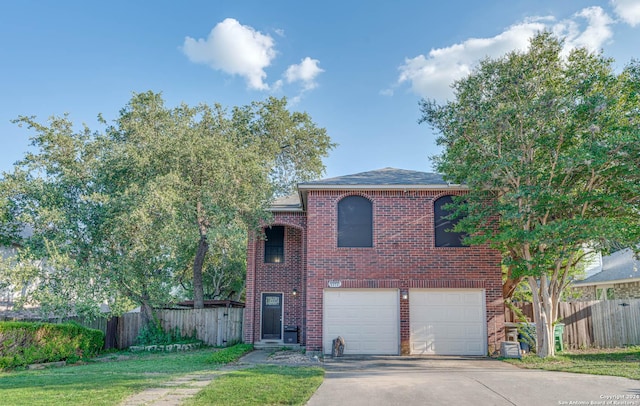 view of front of property featuring a garage and a front yard