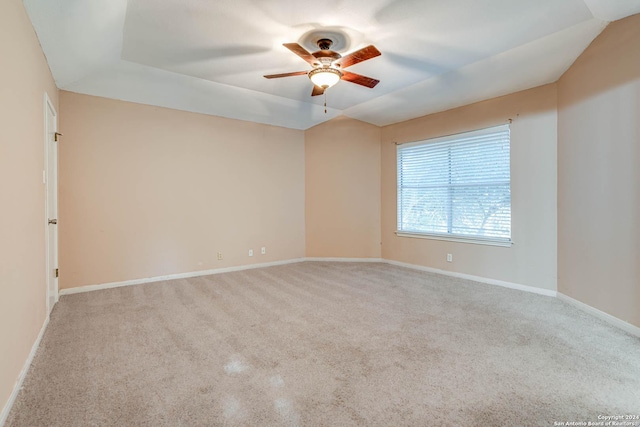 unfurnished room with ceiling fan and light colored carpet