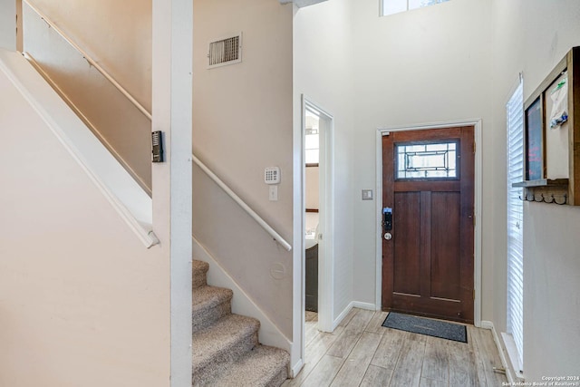 foyer entrance with light hardwood / wood-style flooring