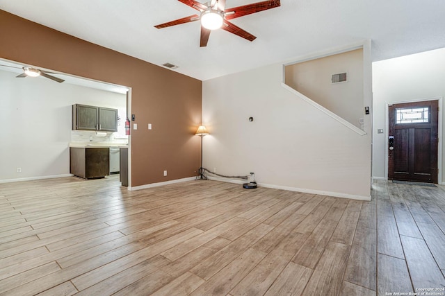 unfurnished living room featuring light wood-type flooring and ceiling fan