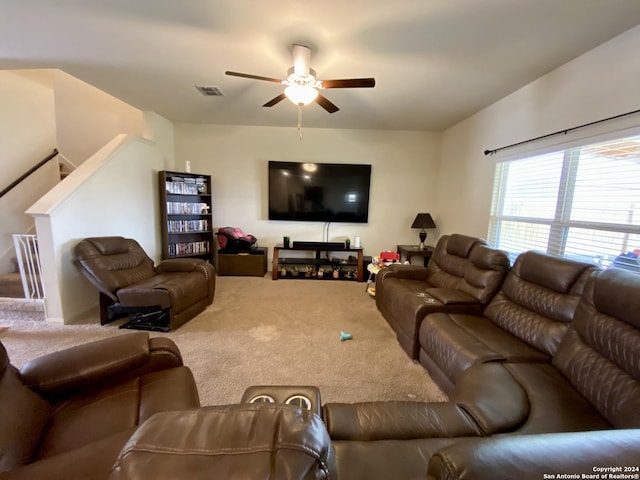 living room featuring carpet floors and ceiling fan