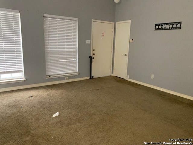 unfurnished room with carpet