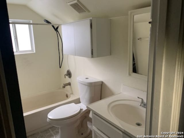 full bathroom featuring shower / bathing tub combination, vanity, toilet, and vaulted ceiling