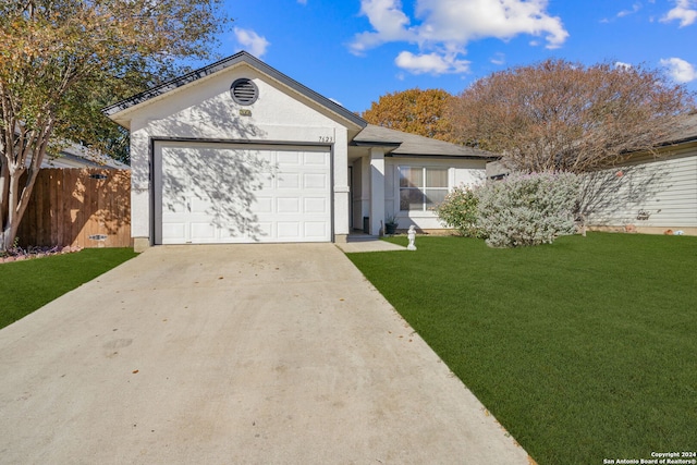 ranch-style house with a garage and a front lawn