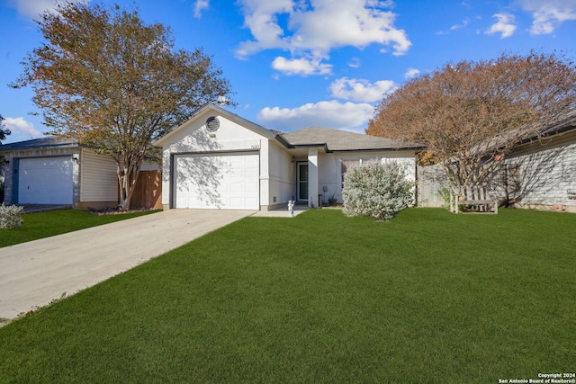 single story home featuring a front yard and a garage