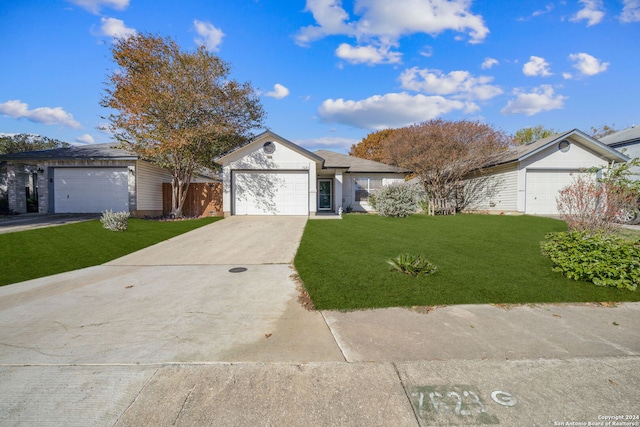 ranch-style house featuring a front yard and a garage