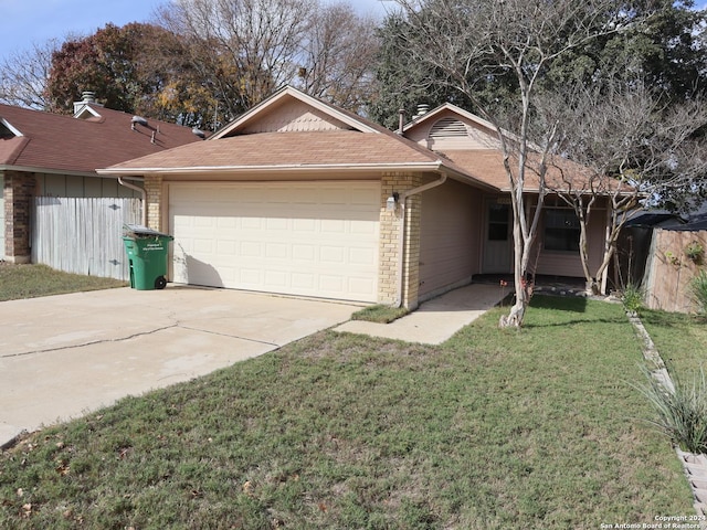 single story home with a garage and a front lawn