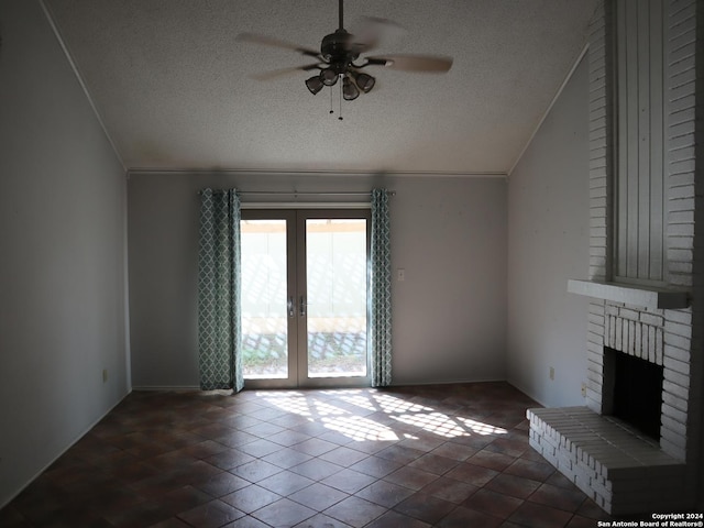 unfurnished living room featuring a fireplace, french doors, a textured ceiling, and ceiling fan