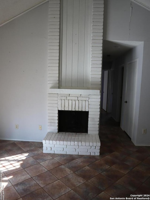 details featuring a textured ceiling and a brick fireplace