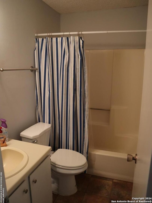 full bathroom with vanity, shower / bathtub combination with curtain, a textured ceiling, and toilet